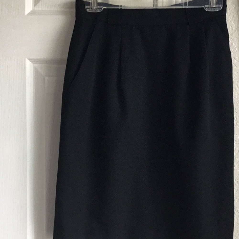 Classic black wool skirt with full lining.